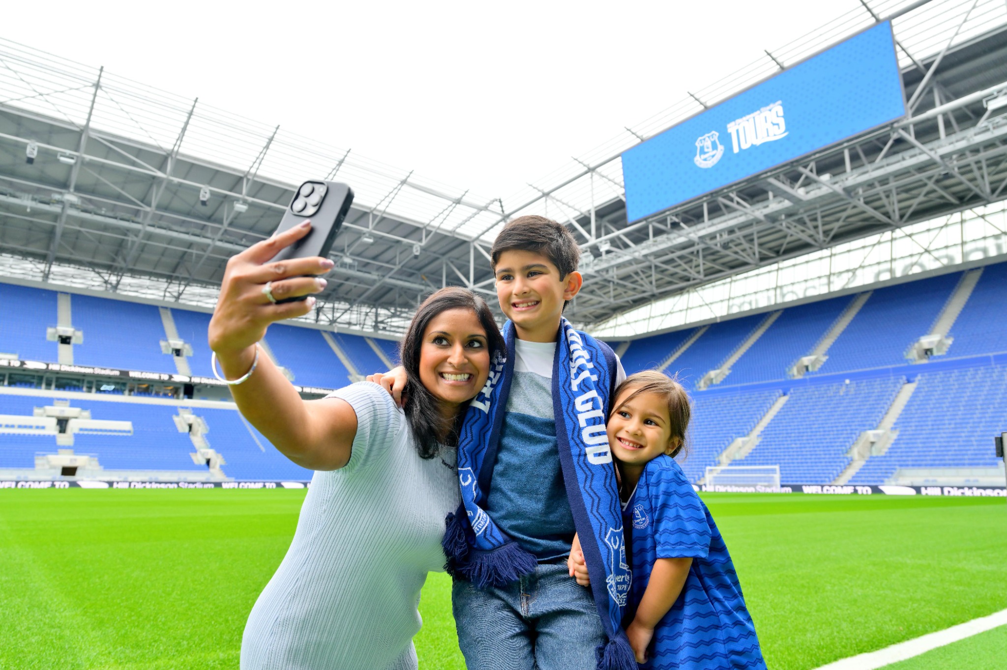Visitors enjoying an Everton stadium tour inside Hill Dickinson Stadium